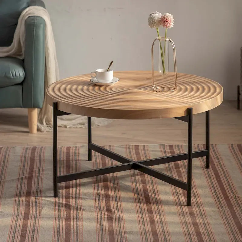 Table basse ronde au design moderne avec piètement en métal croisé