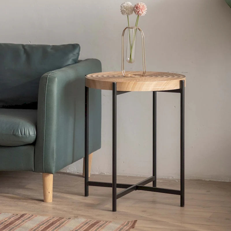 Table basse ronde au design moderne avec piètement en métal croisé