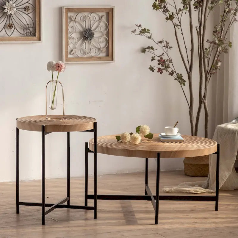 Table basse ronde au design moderne avec piètement en métal croisé