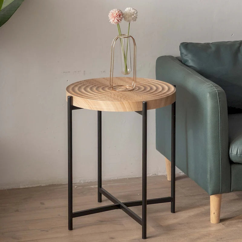 Table basse ronde au design moderne avec piètement en métal croisé