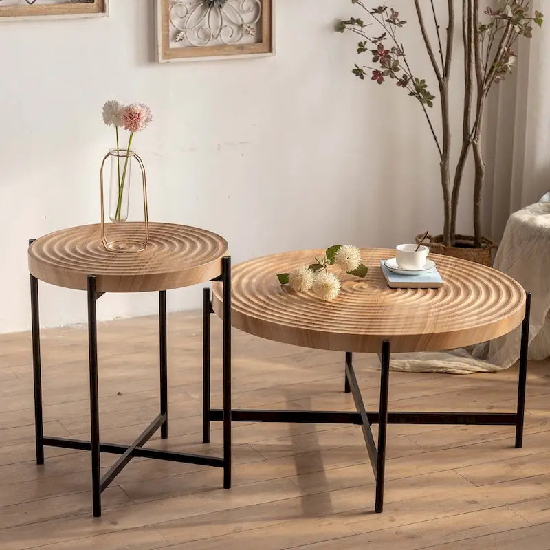 Table basse ronde au design moderne avec piètement en métal croisé