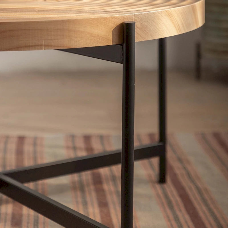 Table basse ronde au design moderne avec piètement en métal croisé