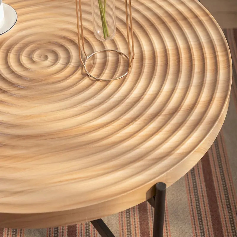 Table basse ronde au design moderne avec piètement en métal croisé
