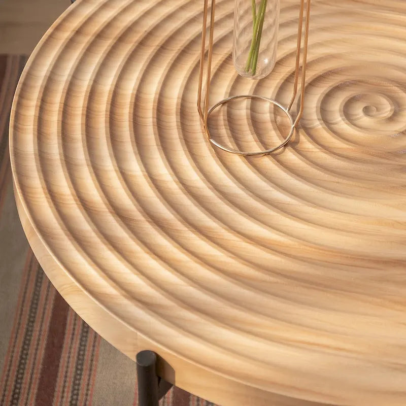 Table basse ronde au design moderne avec piètement en métal croisé