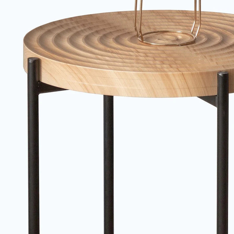 Table basse ronde au design moderne avec piètement en métal croisé